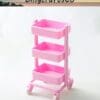 Pink three-tier plastic rolling cart with wheels, against a light background, labeled LingcraftsCo.