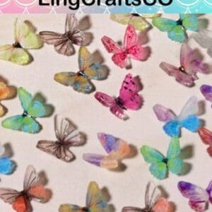 Colorful paper butterflies scattered on a light surface, showcasing various vibrant hues and intricate designs.