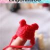 Tiny red crocheted bear hat on a finger, with blurred background and "LingCraftsCO" text above.