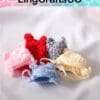 Five colorful crocheted bear hats on a white surface, including pink, red, gray, yellow, and blue.