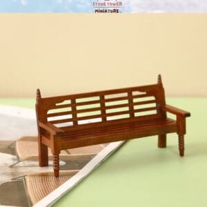 Miniature wooden bench displayed on an open magazine with a light background.