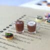 Miniature coffee cups and donuts on a menu page.