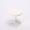 White, round, miniature wooden table with a pedestal base on a plain white background.