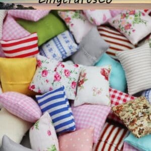 A collection of colorful, patterned mini pillows in various fabrics, featuring stripes and floral designs.