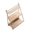 A miniature wooden three-tier shelf with a simple, slatted design on a white background.
