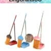 Miniature brooms and dustpans in brown, blue, and pink with a large coin for scale.