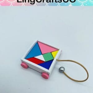 Colorful wooden pull toy with geometric shapes, pink wheels, and a string, from LingCraftsCO.