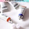 Open tubes of watercolor paint on a white surface with a colorful LingCraftsCO banner above.