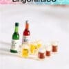 Miniature bottles and mugs of beer with foam on a white background, labeled by LingCraftsCO.