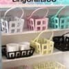 Colorful plastic storage baskets on shelves with mugs, labeled LingCraftsCO.