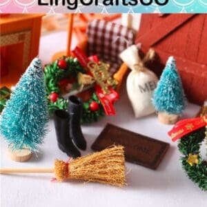 Miniature Christmas scene with small trees, wreaths, boots, and a broom on a white surface, branded by LingCraftsCO.