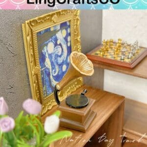 Miniature room with a gramophone, chessboard, framed painting, and tulips on a wooden shelf.