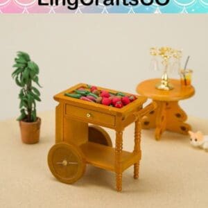 Miniature wooden cart with vegetables, beside a small table with glasses and a potted plant on a beige surface.