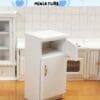 Miniature white cabinet with open doors in a model kitchen setting, labeled "Stone Tower Miniature.
