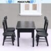 Miniature black dining table set with four chairs in front of a small window.